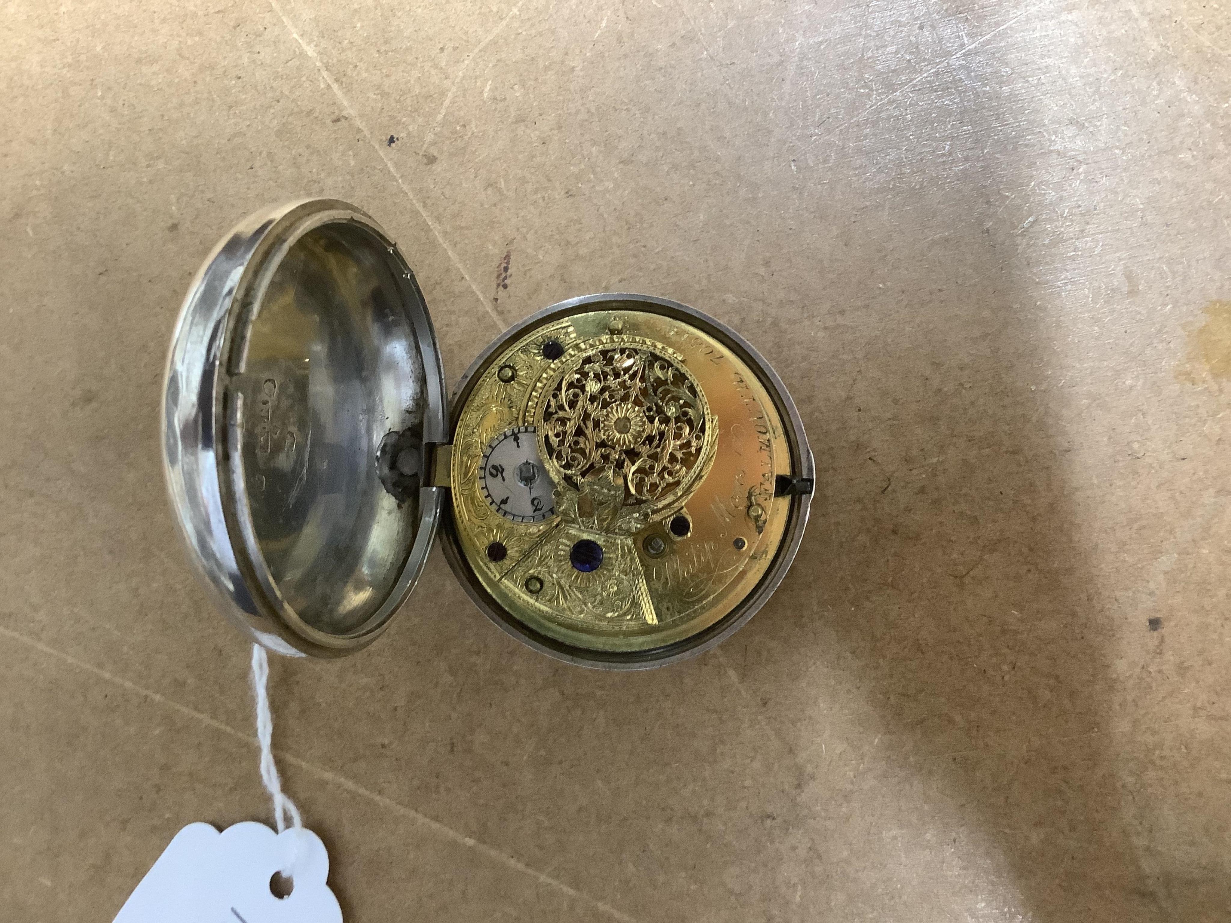 A George III silver pair cased verge pocket watch, by Philip Moses of Falmouth, with Roman dial, the signed movement numbered 70514, case diameter 56mm.